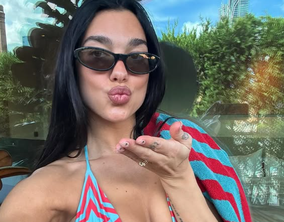 Dua Lipa Stuns in Retro ’70s Swimsuit While Enjoying a Poolside Getaway in Sydney